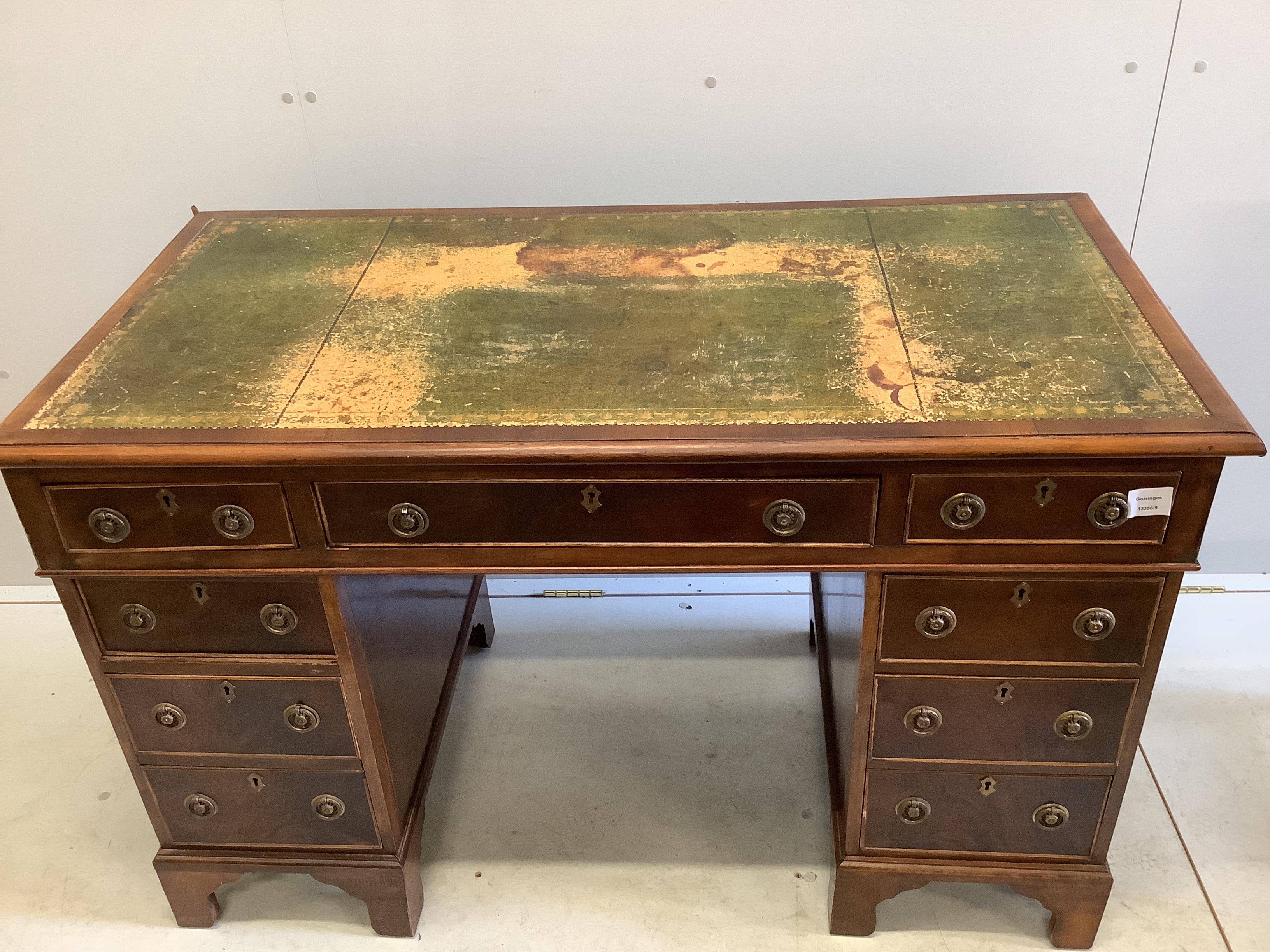 A late Victorian mahogany pedestal desk, width 121cm, depth 61cm, height 77cm together with a later oak elbow chair